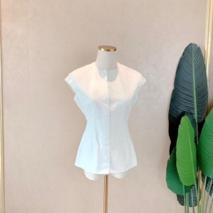 Blusa de la Sra. Dior blusa blanca sin mangas